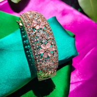 B0319_Grand flower design bracelets studded with delicate work of american diamond stones with a touch of  pink stone.