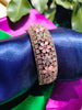 B0319_Grand flower design bracelets studded with delicate work of american diamond stones with a touch of  pink stone.