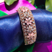 B0319_Grand flower design bracelets studded with delicate work of american diamond stones with a touch of  pink stone.