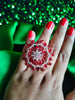 R078_Classic Grand circular design rose gold American Diamond studded statement ring with a touch of red stones.
