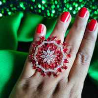 R078_Classic Grand circular design rose gold American Diamond studded statement ring with a touch of red stones.