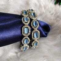 B0319_ Royal style Silver plated bangles studded with  American Diamond stones with a touch of blue stones.