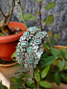 B0350_S_Elegant flowery design Bangles studded with American Diamond stones with a touch of mint green stones with delicate stone work.