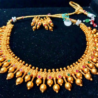 Pleasing and graceful necklaces laden with exquisite work of Temple jewelry structure and ruby stones