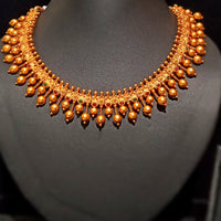 Pleasing and graceful necklaces laden with exquisite work of Temple jewelry structure and ruby stones