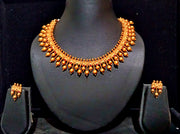 Pleasing and graceful necklaces laden with exquisite work of Temple jewelry structure and ruby stones