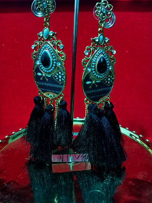 Stand-out dangler with non-precious metal base studded with trendy silk threads