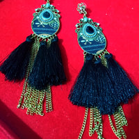 Stand-out dangler with non-precious metal base studded with trendy silk threads