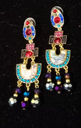 Stand-out dangler with non-precious metal base studded with trendy silk threads