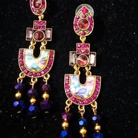 Stand-out dangler with non-precious metal base studded with trendy silk threads