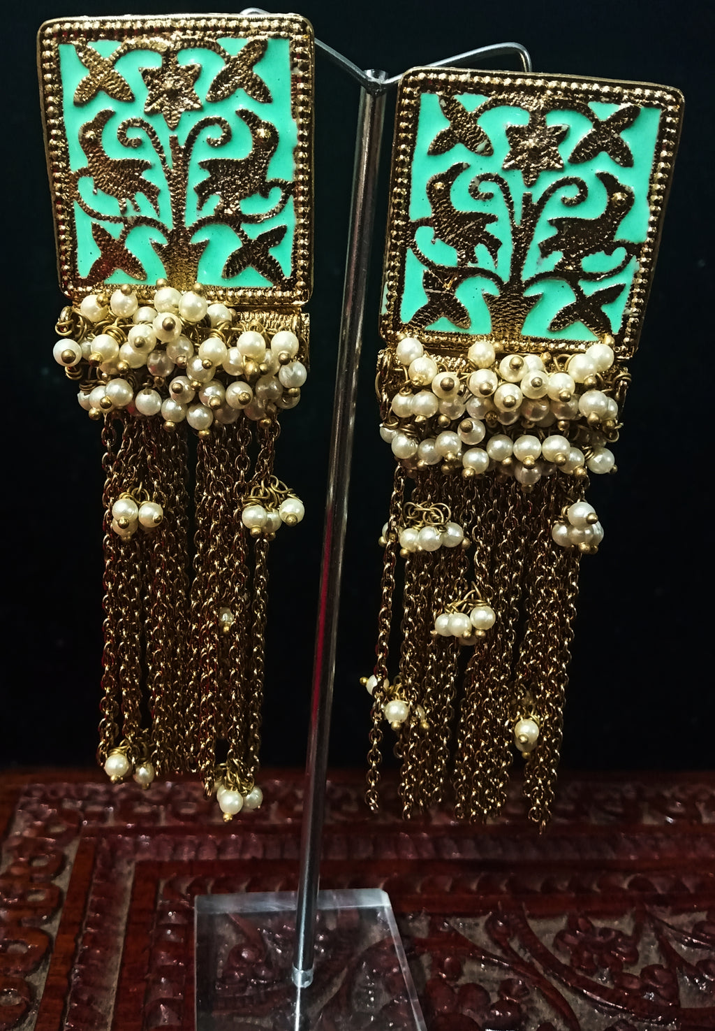 Classy earring with delicate work of pearl and  Meenakari work meant to put your fashion quotient higher .