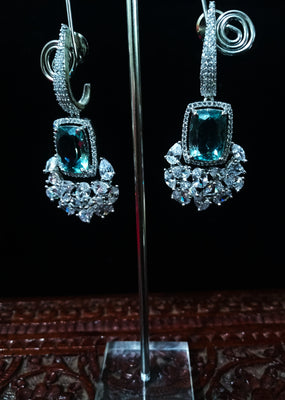 Sparkling Silver based earring with careful stitching of American Diamond