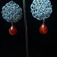 Sparkling Silver based earring with careful stitching of American Diamond