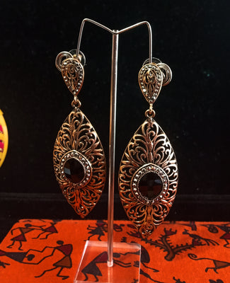 Stand-out dangler with non-precious metal base studded with trendy stones