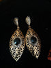 Stand-out dangler with non-precious metal base studded with trendy stones
