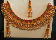 Pleasing and graceful necklaces laden with exquisite work of Temple jewelry structure and ruby stones