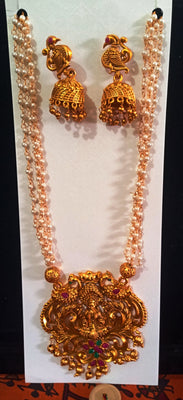 Pleasing and graceful necklaces laden with exquisite work of Temple jewelry structure and ruby stones