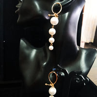 Stand-out dangler with non-precious metal base studded with pearls.