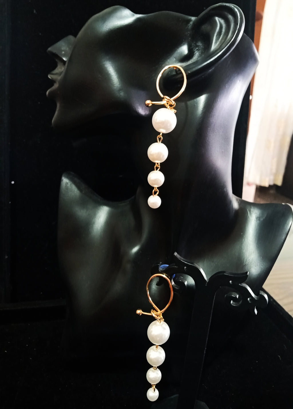 Stand-out dangler with non-precious metal base studded with pearls.