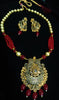 Pleasing and graceful Jaipur necklace laden with exquisite work of red & off white pearls and red crystal