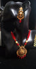 Pleasing and graceful Jaipur necklace laden with exquisite work of red & off white pearls and red crystal