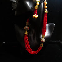 Pleasing and graceful necklace laden with exquisite work of red crystals, beautiful pearls and kundan