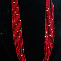 Pleasing and graceful necklace laden with exquisite work of red crystals, beautiful golden balls