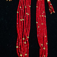 Pleasing and graceful necklace laden with exquisite work of red crystals, beautiful golden balls