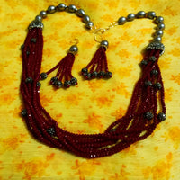 Pleasing and graceful necklace laden with exquisite work of wine colored crystals, beautiful high quality pearls