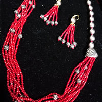 Pleasing and graceful necklace laden with exquisite work of wine colored crystals, beautiful high quality pearls