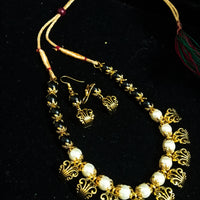 Pleasing and graceful Jaipur necklace laden with exquisite work of off white pearls .