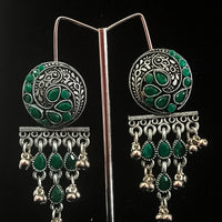 Silver oxidized earrings with green ruby studded and exclusive silver work for a stunning and stylish look.