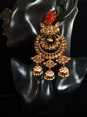 Classy Light Weight Red Colored multilayered Jumki Earring with delicate work of pearl and  Meenakari work.