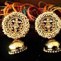 E0114_Classy golden colored earring with delicate work of pearl & peach colored semi precious stones and  Meenakari work.
