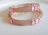 B046_ Classy Rose Gold plated bangles studded with  American Diamond stones.