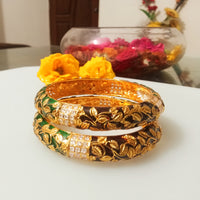 B042_Gorgeous Bangles crafted with delicate meena work with green and red zari combination studded with stones.
