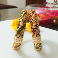 B042_Gorgeous Bangles crafted with delicate meena work with green and red zari combination studded with stones.