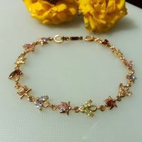 B044_Gorgeous Rose gold base bracelet studded with multi color semi precious stones.