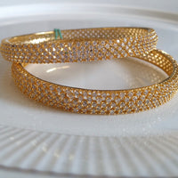 B060_Gorgeous Gold plated bangles studded with  American Diamond stones.