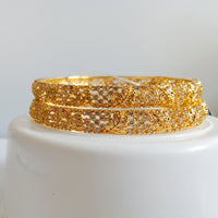 B064_Gorgeous Gold plated bangles  studded with  American Diamond  stones.