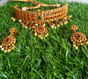 N0105_Elegant Temple jewelry style matte gold polish necklace set studded with American Diamond  stones with a touch of pink & green ruby stones.