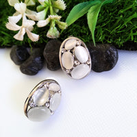 E0417_Classy studs studded with grey & white color stones with touch of metal base.