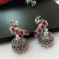 E0499_ Classy German silver oxidized crafted jumkas with peacock design and with a touch of bright red stones (medium size hanging)