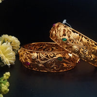 B045_Gorgeous Matte Gold  plated bangles studded with pink and green ruby stones.