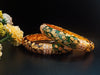 B042_Gorgeous Bangles crafted with delicate meena work with green and red zari combination studded with stones.