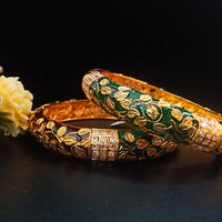 B042_Gorgeous Bangles crafted with delicate meena work with green and red zari combination studded with stones.