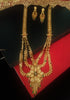 N0176_Ravishing traditional style Gold plated long layered grand necklace set with fine artwork of floral designs studded with pink and green ruby stones with a touch of broad chain drop pendant.