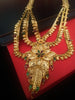 N0176_Ravishing traditional style Gold plated long layered grand necklace set with fine artwork of floral designs studded with pink and green ruby stones with a touch of broad chain drop pendant.
