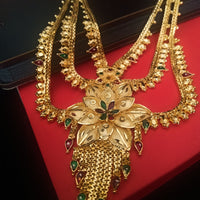 N0176_Ravishing traditional style Gold plated long layered grand necklace set with fine artwork of floral designs studded with pink and green ruby stones with a touch of broad chain drop pendant.