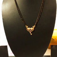 N0183_Elegant style mangalsutra with beautiful peacock design pendant studded with American Diamond stones with a touch of pink and green ruby stones.